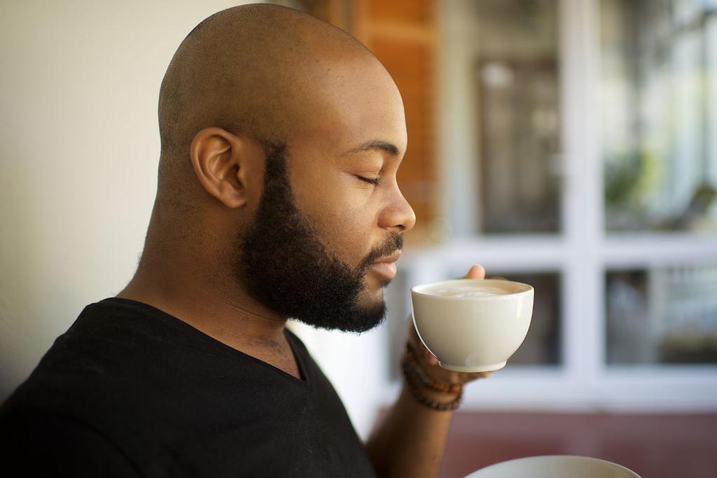 Man Smelling Morning Coffee
